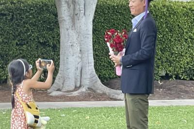 Proud moment little girl snapped photos of her father at his graduation